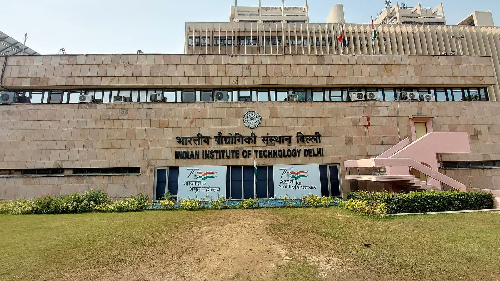 The main building of the Indian Institute of Technology Delhi seen across the front lawn